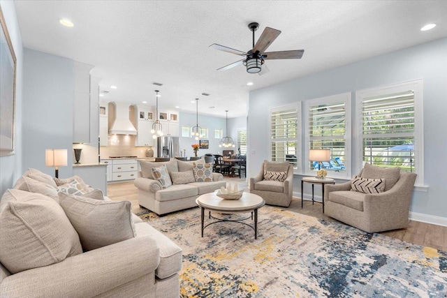 97 Paranza Trce, Saint Augustine, FL 32095 - living area featuring light wood-style flooring, a ceiling fan, plenty of natural light, recessed lighting, and a chandelier