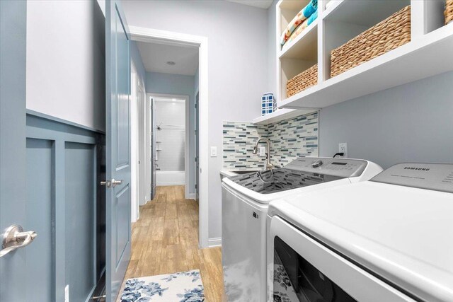 97 Paranza Trce, Saint Augustine, FL 32095 - washroom with separate washer and dryer and light wood finished floors