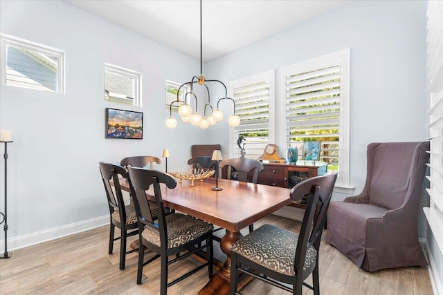 97 Paranza Trce, Saint Augustine, FL 32095 - dining room featuring light wood-style flooring, plenty of natural light, and a chandelier