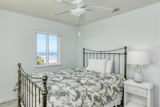 8550 S A1A # 102, Saint Augustine, FL 32080 - bedroom with wood finished floors, ceiling fan, baseboards, and visible vents