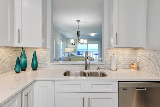8550 S A1A # 102, Saint Augustine, FL 32080 - kitchen featuring pendant lighting, white cabinetry, dishwasher, a sink, and decorative backsplash