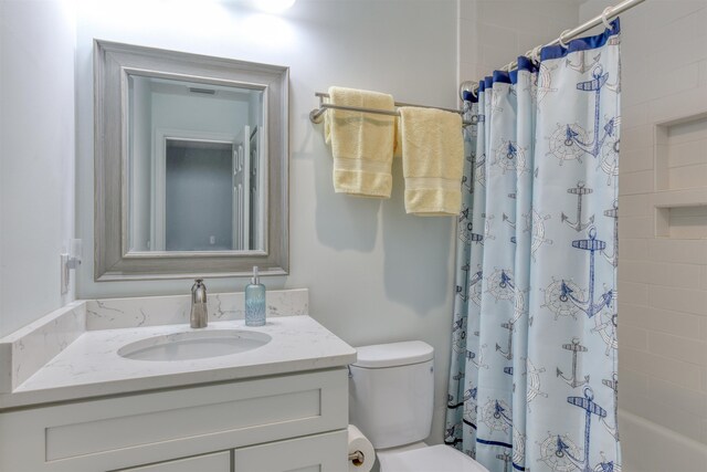 8550 S A1A # 102, Saint Augustine, FL 32080 - bathroom featuring shower / bathtub combination with curtain, vanity, and toilet