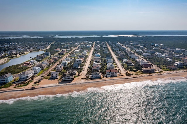 bird's eye view with a water view and a view of the beach