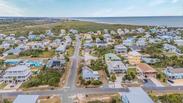 birds eye view of property featuring a water view and a residential view