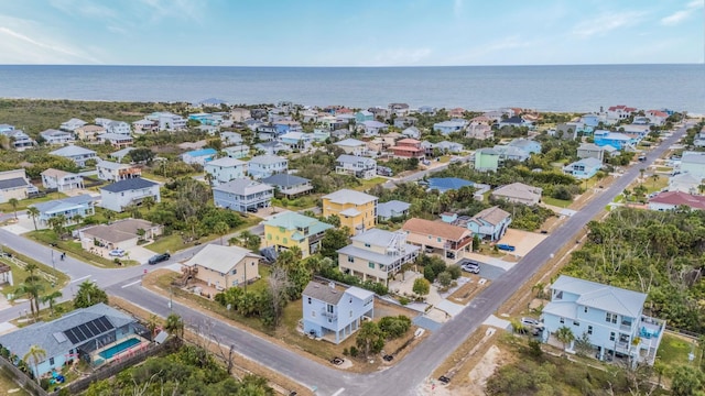 bird's eye view featuring a residential view and a water view