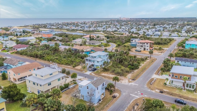 aerial view with a water view and a residential view