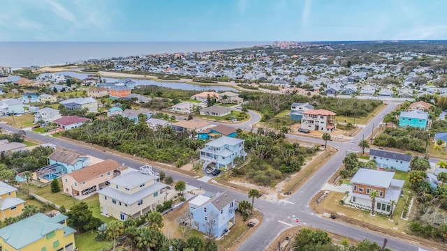 bird's eye view with a residential view and a water view