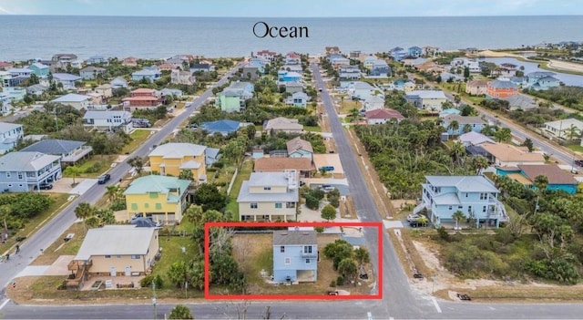 aerial view featuring a water view and a residential view