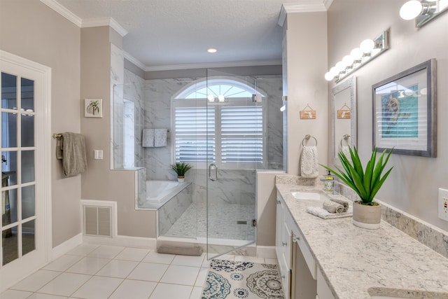 bathroom featuring a textured ceiling, ornamental molding, vanity, and shower with separate bathtub