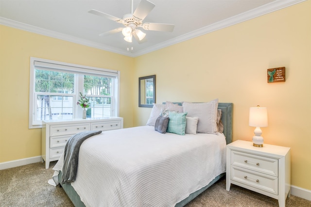 carpeted bedroom with ceiling fan and crown molding