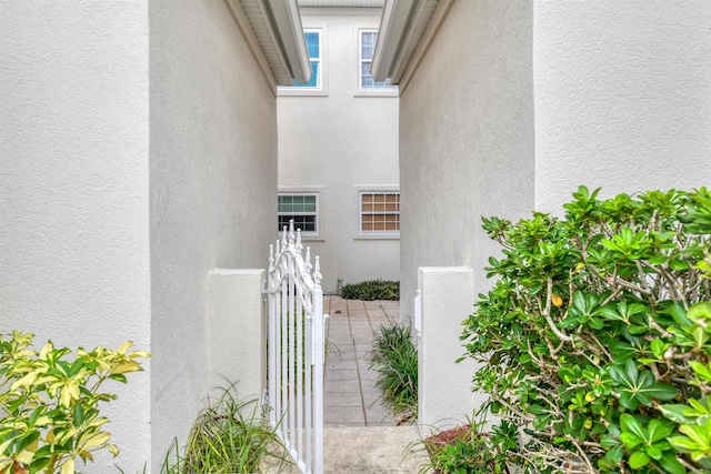 616 Mediterranean Way, Saint Augustine, FL 32080 - exterior space with a gate and stucco siding
