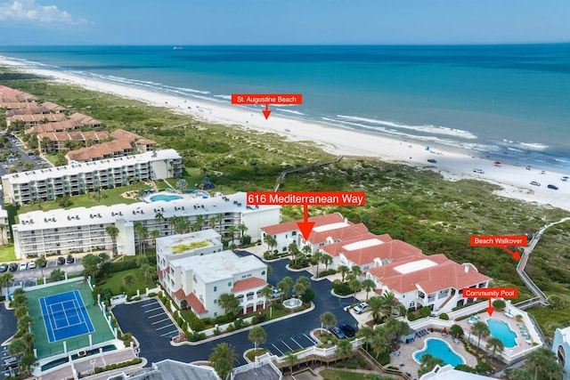 aerial view with a water view and a view of the beach