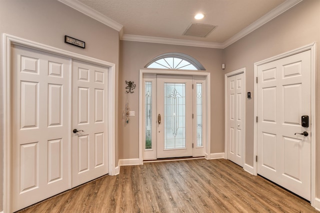 616 Mediterranean Way, Saint Augustine, FL 32080 - foyer entrance with crown molding and light wood-type flooring