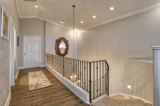 616 Mediterranean Way, Saint Augustine, FL 32080 - hallway featuring recessed lighting, wood finished floors, an upstairs landing, crown molding, and lofted ceiling