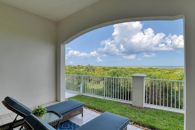 view of patio featuring a balcony