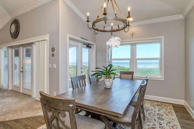 616 Mediterranean Way, Saint Augustine, FL 32080 - dining room featuring a chandelier, dark wood finished floors, and ornamental molding