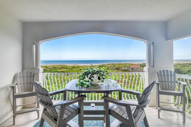 balcony featuring a water view