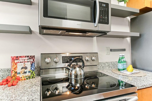 171 Deltona Blvd, Saint Augustine, FL 32086 - kitchen view of stainless steel appliances, open shelves, and light countertops