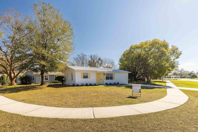 view of front of home with a front yard