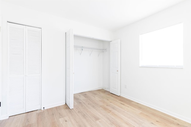 202 Deltona Blvd, Saint Augustine, FL 32086 - unfurnished bedroom with light wood finished floors, two closets, and baseboards