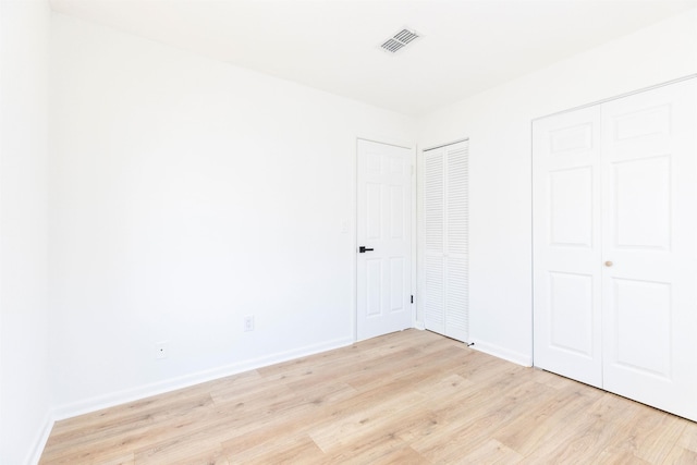 unfurnished bedroom with light hardwood / wood-style flooring