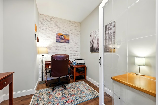 133 Federal Point Rd, East Palatka, FL 32131 - office space featuring an accent wall, baseboards, brick wall, and wood finished floors