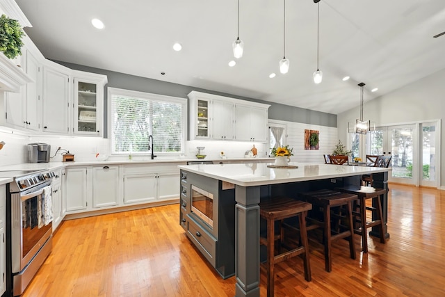 133 Federal Point Rd, East Palatka, FL 32131 - kitchen featuring white cabinets, backsplash, stainless steel appliances, and a sink