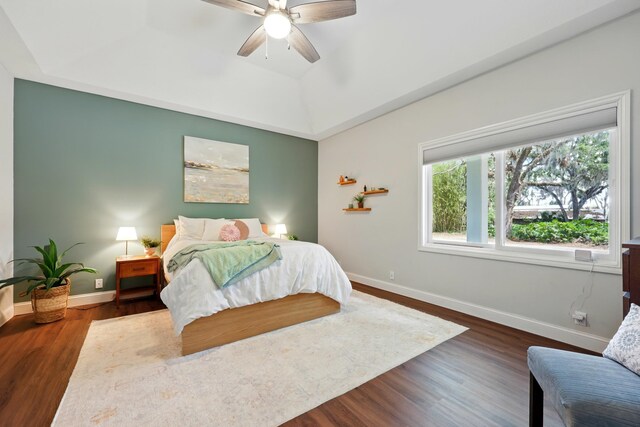 133 Federal Point Rd, East Palatka, FL 32131 - bedroom with dark wood-style flooring, baseboards, a raised ceiling, and ceiling fan