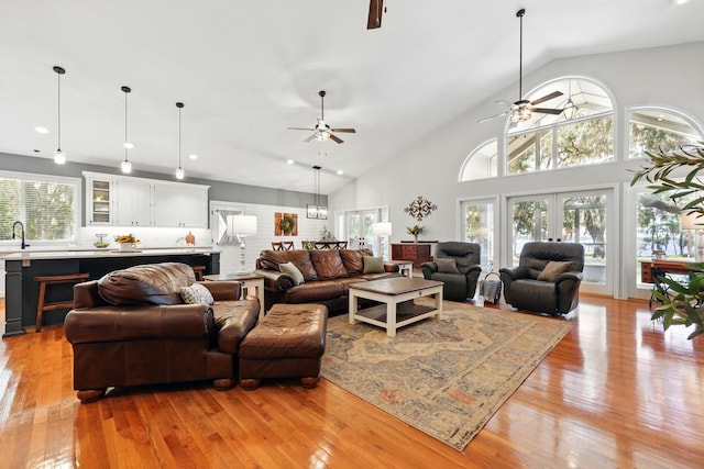 133 Federal Point Rd, East Palatka, FL 32131 - living room with high vaulted ceiling, a ceiling fan, and light wood-style floors