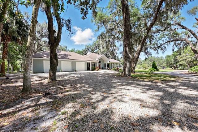 133 Federal Point Rd, East Palatka, FL 32131 - view of front of house featuring gravel driveway and a garage