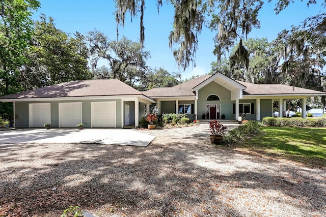 133 Federal Point Rd, East Palatka, FL 32131 - view of front of property with concrete driveway, a shingled roof, and a garage