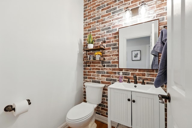 133 Federal Point Rd, East Palatka, FL 32131 - half bath featuring brick wall, vanity, and toilet