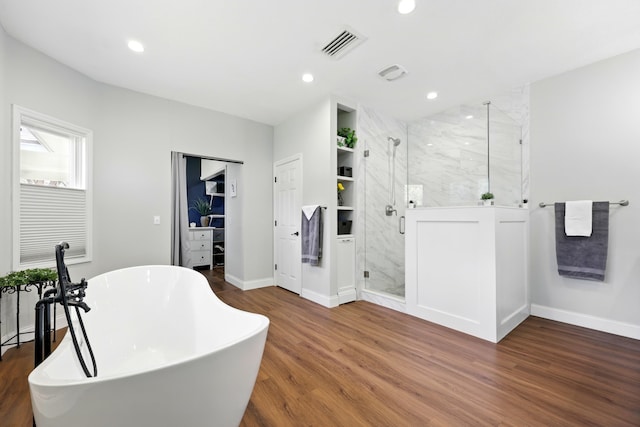 133 Federal Point Rd, East Palatka, FL 32131 - bathroom with a marble finish shower, wood finished floors, visible vents, a freestanding tub, and recessed lighting