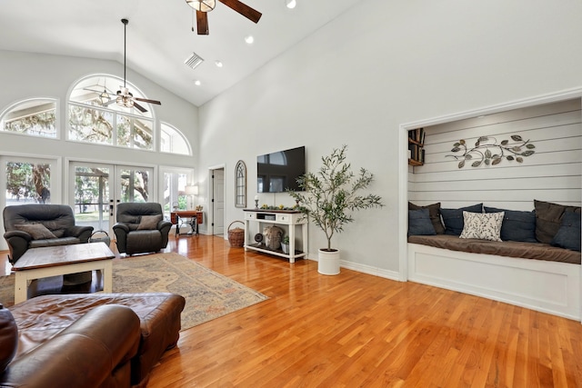 133 Federal Point Rd, East Palatka, FL 32131 - living area with ceiling fan, light wood finished floors, high vaulted ceiling, and a healthy amount of sunlight