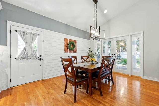 133 Federal Point Rd, East Palatka, FL 32131 - dining space featuring french doors, light wood finished floors, an inviting chandelier, and high vaulted ceiling