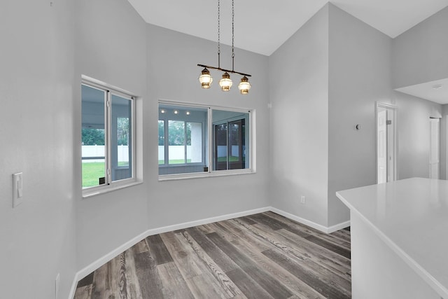 61 Brownstone Ln, Palm Coast, FL 32137 - unfurnished dining area featuring wood finished floors and baseboards