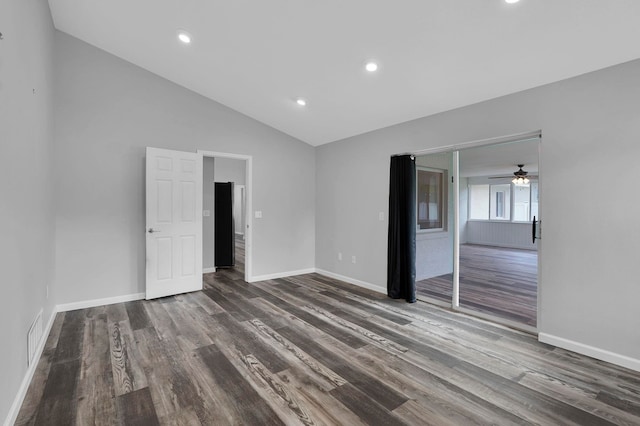 61 Brownstone Ln, Palm Coast, FL 32137 - unfurnished bedroom with dark wood-style flooring, lofted ceiling, and recessed lighting