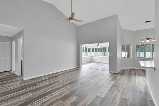 61 Brownstone Ln, Palm Coast, FL 32137 - unfurnished living room featuring ceiling fan, high vaulted ceiling, healthy amount of natural light, and wood finished floors
