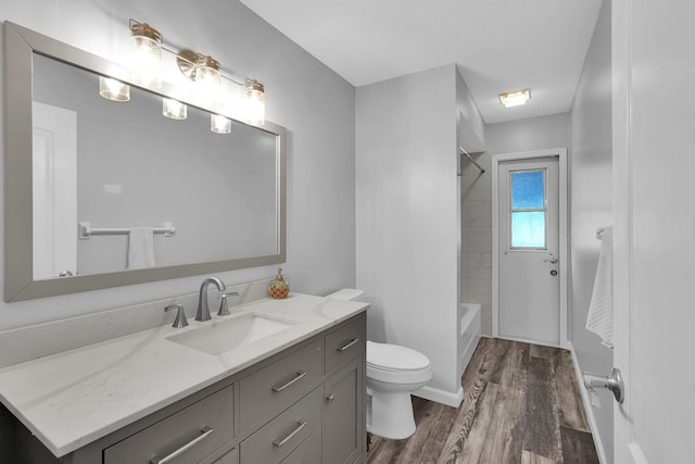 61 Brownstone Ln, Palm Coast, FL 32137 - full bath with wood finished floors, vanity, and washtub / shower combination