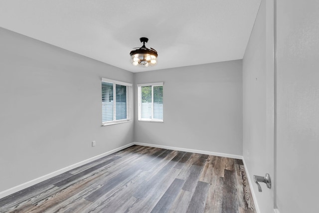 61 Brownstone Ln, Palm Coast, FL 32137 - empty room featuring wood finished floors and baseboards