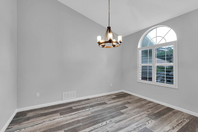 61 Brownstone Ln, Palm Coast, FL 32137 - unfurnished room featuring a chandelier, wood finished floors, and high vaulted ceiling