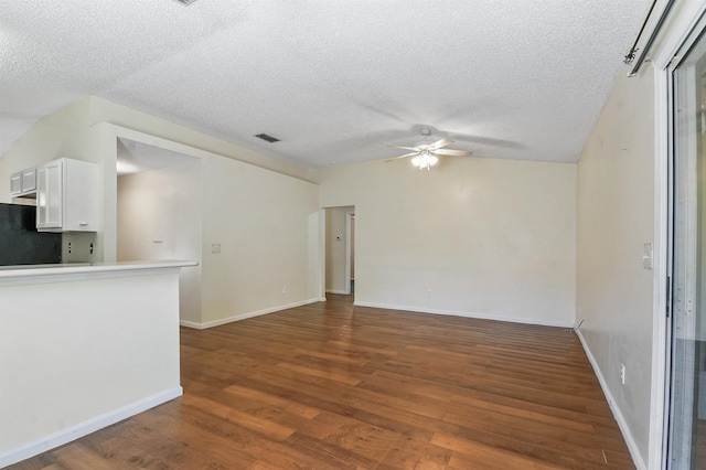 726 Calico Jack Way, Green Cove Springs, FL 32043 - unfurnished living room featuring a ceiling fan, wood finished floors, a textured ceiling, and baseboards