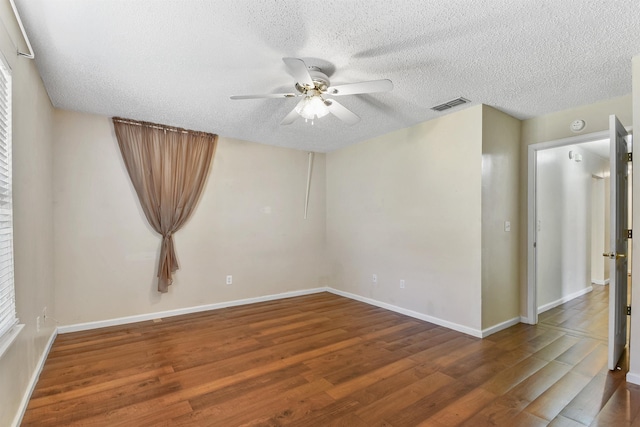 726 Calico Jack Way, Green Cove Springs, FL 32043 - unfurnished room with wood finished floors, a ceiling fan, a textured ceiling, and baseboards