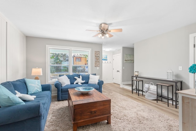 112 2nd St, Saint Augustine, FL 32080 - living room with ceiling fan, light wood-style floors, and baseboards