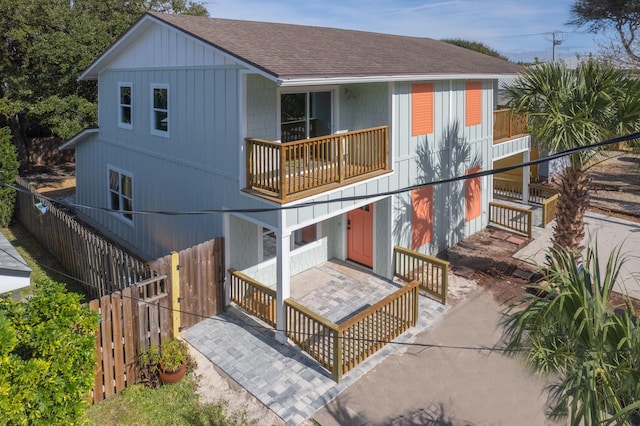 112 2nd St, Saint Augustine, FL 32080 - rear view of property featuring a balcony and roof with shingles