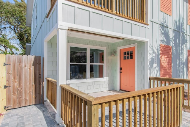 112 2nd St, Saint Augustine, FL 32080 - doorway to property featuring a porch and board and batten siding
