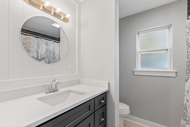 112 2nd St, Saint Augustine, FL 32080 - bathroom with vanity, toilet, and baseboards