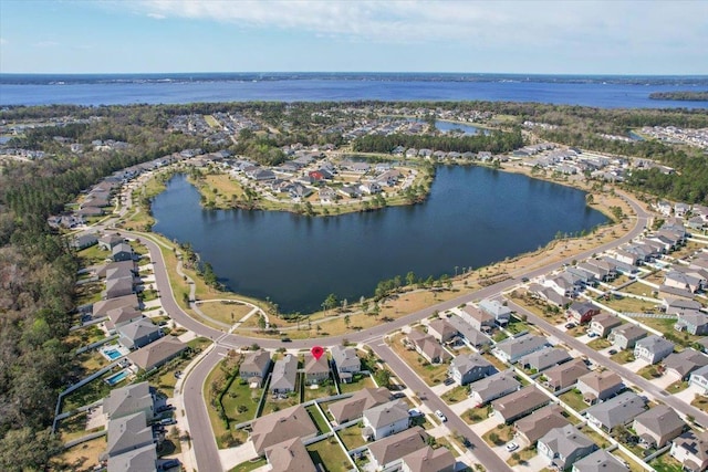 birds eye view of property with a residential view and a water view