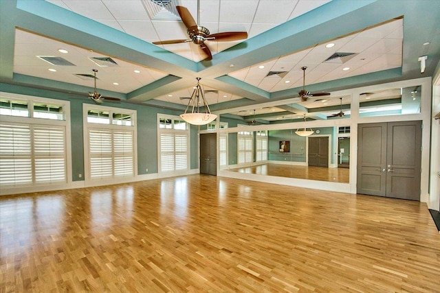 unfurnished living room featuring visible vents, light wood-style flooring, and ceiling fan