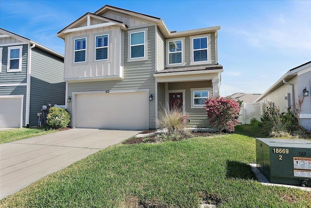 craftsman inspired home with board and batten siding, a front lawn, driveway, and a garage